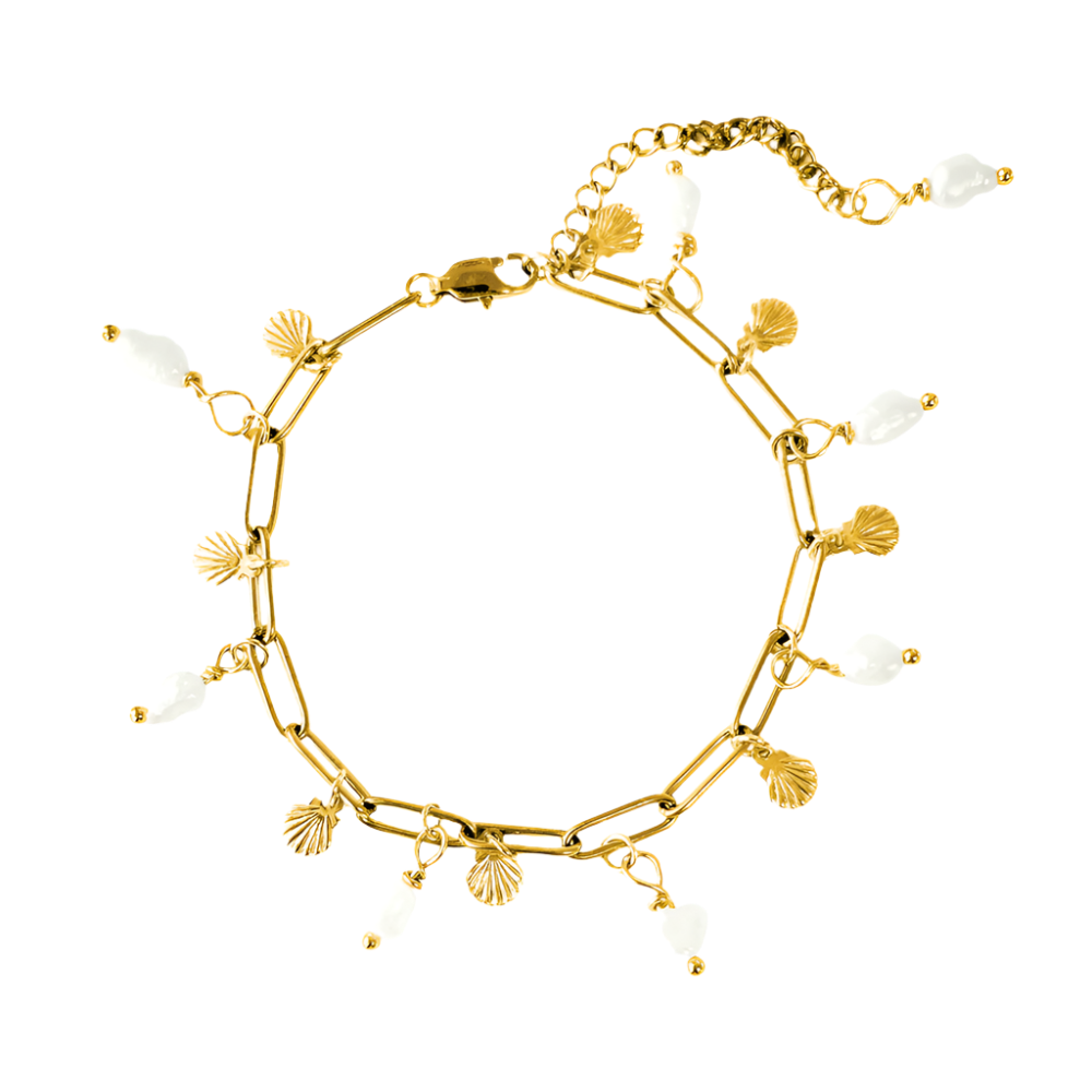 Elegantly designed pearl charm bracelet featuring seashells and freshwater pearls, showcasing a delicate and ocean-inspired aesthetic.