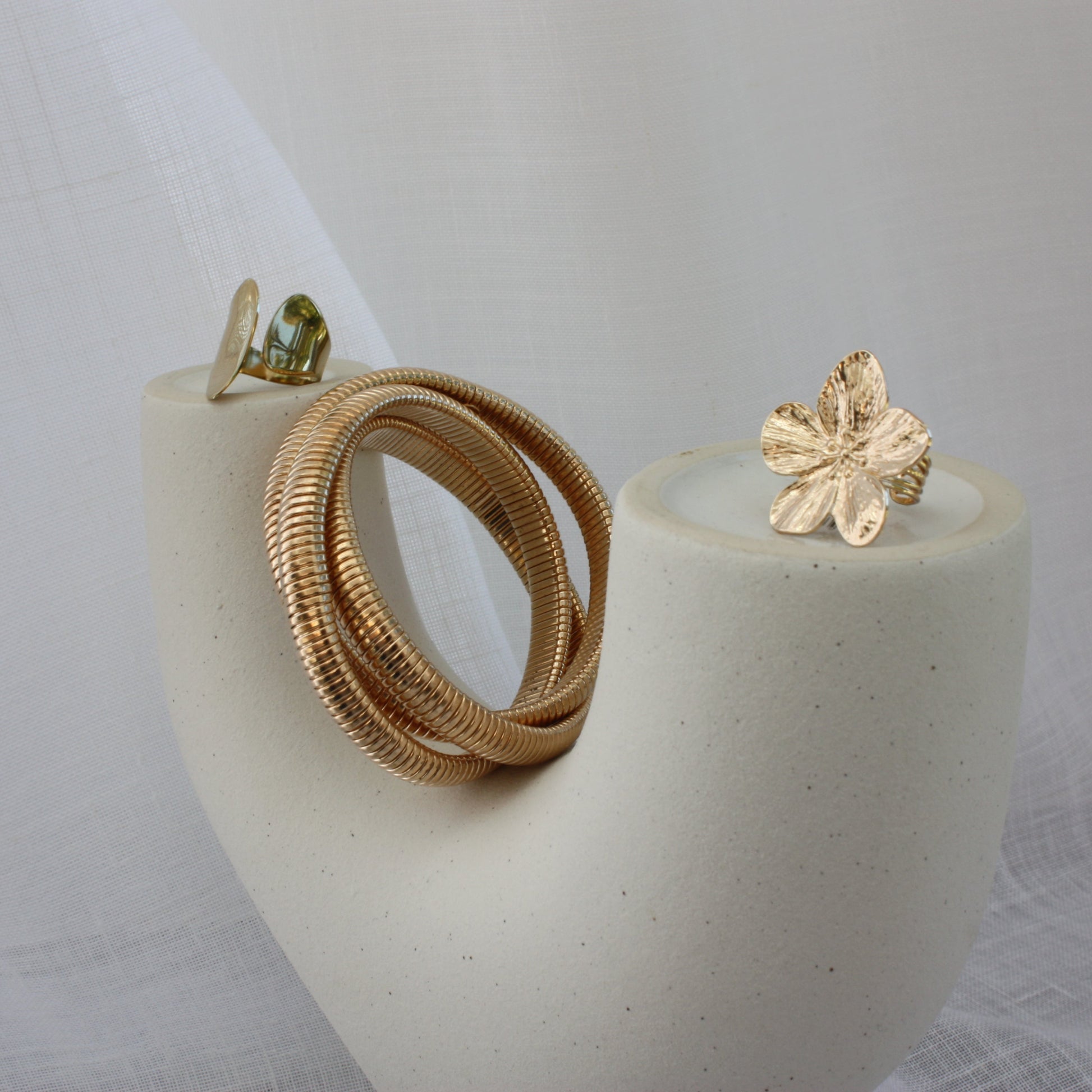 Slender Rowe Bangle by ÈRE on a model's wrist, capturing the elegance of the gold bangle in everyday wear.